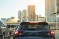 Miami street traffic with driving cars at urban intersection with traffic lights in Florida Royalty Free Stock Photo