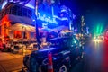 Vintage car parked at night in front of art deco hotel in Miami beach Royalty Free Stock Photo