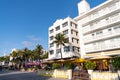Miami, USA - April 15, 2021: South Beach sidewalk cafes along art-deco hotels at Ocean Drive