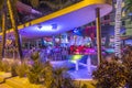 people enjoy nightlife at Ocean Drive along South Beach Miami in the historic Art Deco District with hotels, restaurant and bars