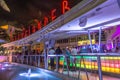 people enjoy nightlife at Ocean Drive along South Beach Miami in the historic Art Deco District with hotels, restaurant and bars