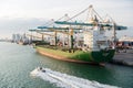 Miami, USA - March, 18, 2016: cargo ship with cranes in sea port. Maritime container port or terminal. Shipping, freight, logistic Royalty Free Stock Photo