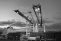 Miami, USA - March 01, 2016: containers in cargo port. Containers and cranes illuminated in dusk. Container ship