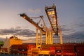 Miami, USA - March 01, 2016: cranes and cargo containers stacked in port. Container port or terminal with night Royalty Free Stock Photo