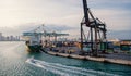 Maritime container port with cargo ship, cranes. Sea port, terminal or dock. Freight, shipping, delivery, logistics Royalty Free Stock Photo