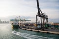 Miami, USA - March, 18, 2016: maritime container port with cargo ship, cranes. Sea port, terminal or dock. Freight, shipping, deli Royalty Free Stock Photo