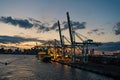 Miami, USA - March 01, 2016: sea port and city skyline at dusk. Sea cargo. Sea boats and cranes with illumination Royalty Free Stock Photo