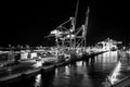 Miami, USA - November, 23, 2015: maritime container port with cargo containers, cranes at night. Port or terminal with Royalty Free Stock Photo