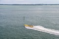 Miami, USA - November 22, 2015: speedboat move fast on sea water. Speed, extreme, energy, power. Boat, vessel, transport. Wanderlu