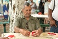 MIAMIA, FLORIDA - APRIL 29, 2015: Little Havana district in Miami and People playing Domino in Maximo Gomez Park Domino Park