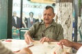 MIAMIA, FLORIDA - APRIL 29, 2015: Little Havana district in Miami and People playing Domino in Maximo Gomez Park Domino Park