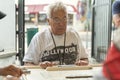 MIAMIA, FLORIDA - APRIL 29, 2015: Little Havana district in Miami and People playing Domino in Maximo Gomez Park Domino Park