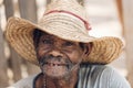 Elderly man wearing a straw hat and smiling. Miandrivazo, Madagascar