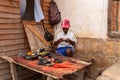 Malagasy man repairs phones on the street. Miandrivazo, Madagascar