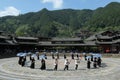 Miao people dance Lusheng together in the midday sun