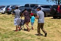 Mibnority Family Going Home After a Day of Fruit Picking Royalty Free Stock Photo