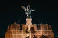 Michael the Archangel bronze statue at night on top of Castle of Holy Angel in Rome, Italy