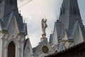 Michael archangel statue on roof of St. Anna Roman Catholic Church, Christian temple in Gothic Revival style