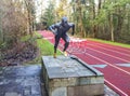 Michael Johnson statue next to a track in the woods in Oregon