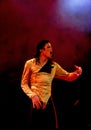 Michael Joseph Jackson singing in his concert isolated on white background.