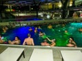 Michalovce, Slovakia - December 30, 2019: People resting at swimming pool in Thermal park Sirava