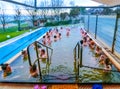 Michalovce, Slovakia - December 30, 2019: People resting at swimming pool in Thermal park Sirava