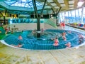 Michalovce, Slovakia - December 30, 2019: People resting at swimming pool in Thermal park Sirava