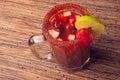 Michelada beer with tomato juice. Clamato with beer on wooden table. Mexican drink. Mexican food. Royalty Free Stock Photo