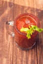 Michelada beer with tomato juice. Clamato with beer on wooden table. Mexican drink. Mexican food. Royalty Free Stock Photo