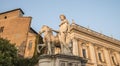 Beautiful view on ancient statue of the Dioscuri with horse at sunset. Piazza del Campidoglio.Capitol hill. Rome. Italy. Europe. Royalty Free Stock Photo