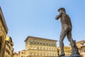 Michelangelo& x27;s David statue standing in front of the Palazzo Vec