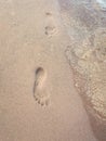 Two footprints in the sand Royalty Free Stock Photo