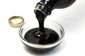 Pouring Molasses in an Ingredient Bowl Royalty Free Stock Photo