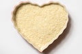 Unsweetened Shredded Coconut in a Heart Shape Bowl Royalty Free Stock Photo