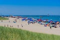 Bystanders at Michigan City, Beach enjoying the bright sun