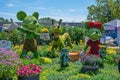 Mickey and Minnie Mouse topiaries with Pluto, Chip and Dale in front of the Disney World\'s Showcase at the Flower and Garden