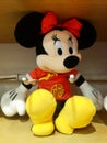 Mickey Mouse - shaped stuffed animals are displayed on the shelves, looking very cute