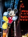 Mickey Mouse sign hanging outside store in Times Square, New York City