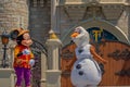 Mickey and Olaf on Mickey`s Royal Friendship Faire on Cinderella Castle in Magic Kingdom at Walt Disney World Resort .