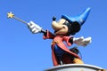 A statue of Mickey Mouse in Disneyland Paris in France on the blue sky background