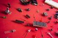Micro electronics arduino DIY components over red background, top view Royalty Free Stock Photo