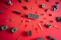 Micro electronics arduino DIY components over red background, top view Royalty Free Stock Photo
