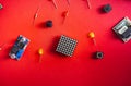 Micro electronics arduino DIY components over red background, top view Royalty Free Stock Photo
