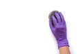 hand with rubber glove holding steel wool scourer pad for cleaning scrub isolated on white .