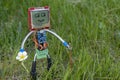 Micro robot in grass on summer nature