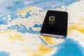 Micro SIM card and smartphone on the world map Royalty Free Stock Photo