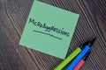 Microaggressions write on sticky notes isolated on Wooden Table