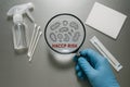 Microbiological contamination risk detection under HACCP protocol using magnifying glass on stainless lab table with cotton swabs Royalty Free Stock Photo