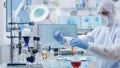 Microbiologist scientist researcher mixing medical solution developing vaccine