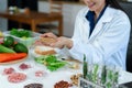 Microbiologists and nutrition experts analyze molecular samples in advanced food science labs Royalty Free Stock Photo